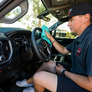 Ricky cleaning car